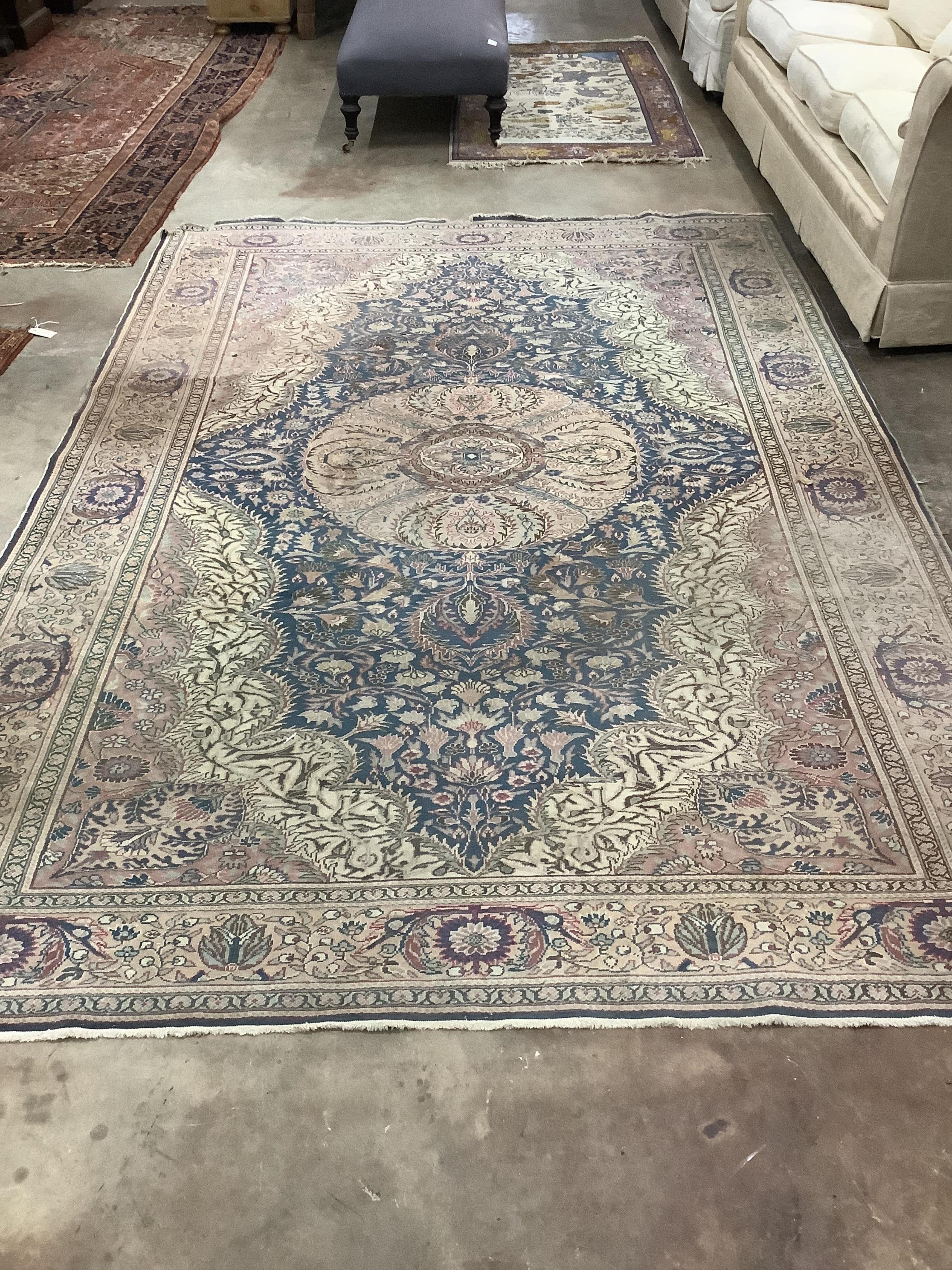 A North West Persian ivory ground carpet, 290 x 200cm. Condition - poor to fair